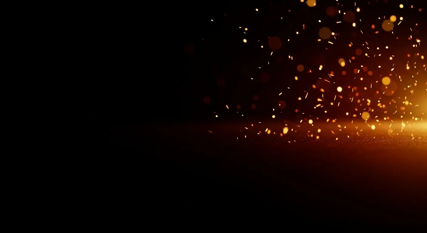 Faint warm embers drifting on a dark background